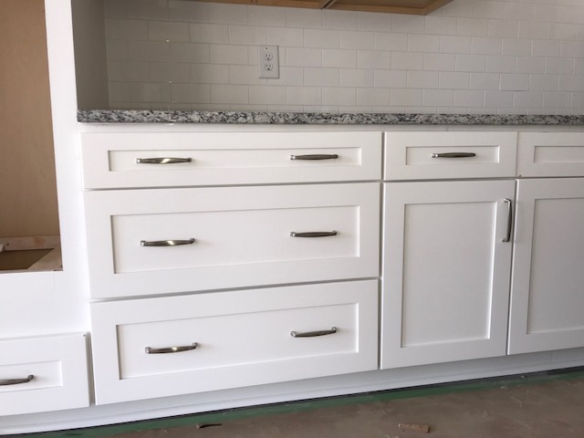 New white Shaker base cabinets and drawers with granite countertop in West Ashley, SC